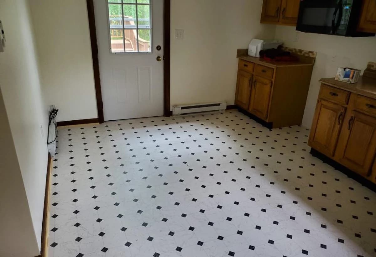 Black and white tile kitchen floor installed in Connecticut