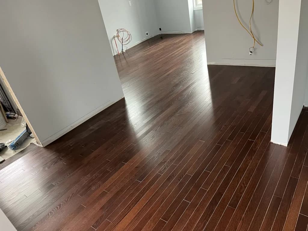 Glossy hardwood flooring installed in a Connecticut room
