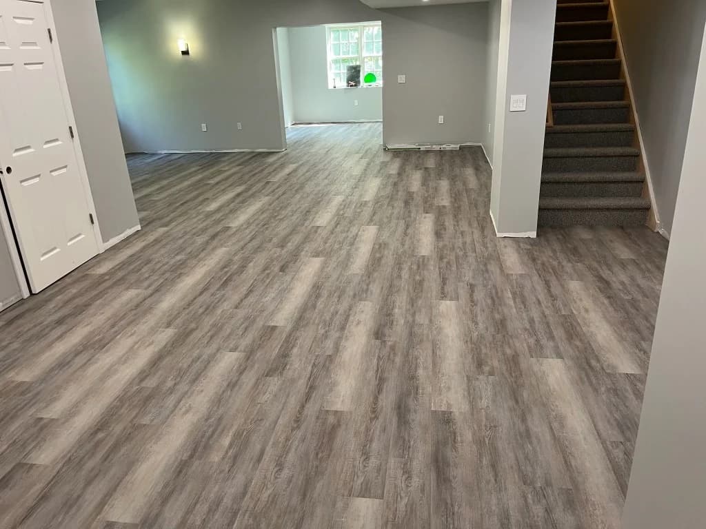 Gray wood-look LVP flooring installed in a Connecticut basement