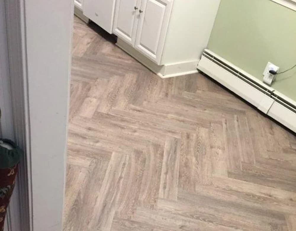 Herringbone LVP kitchen flooring installed in Connecticut