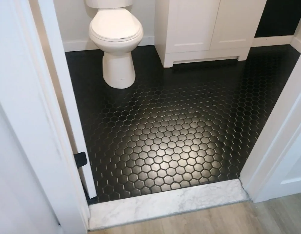 Black hex tile bathroom floor installed in Connecticut