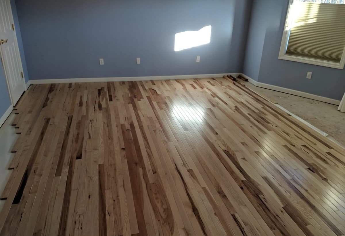 Wide hardwood flooring room installed in Connecticut