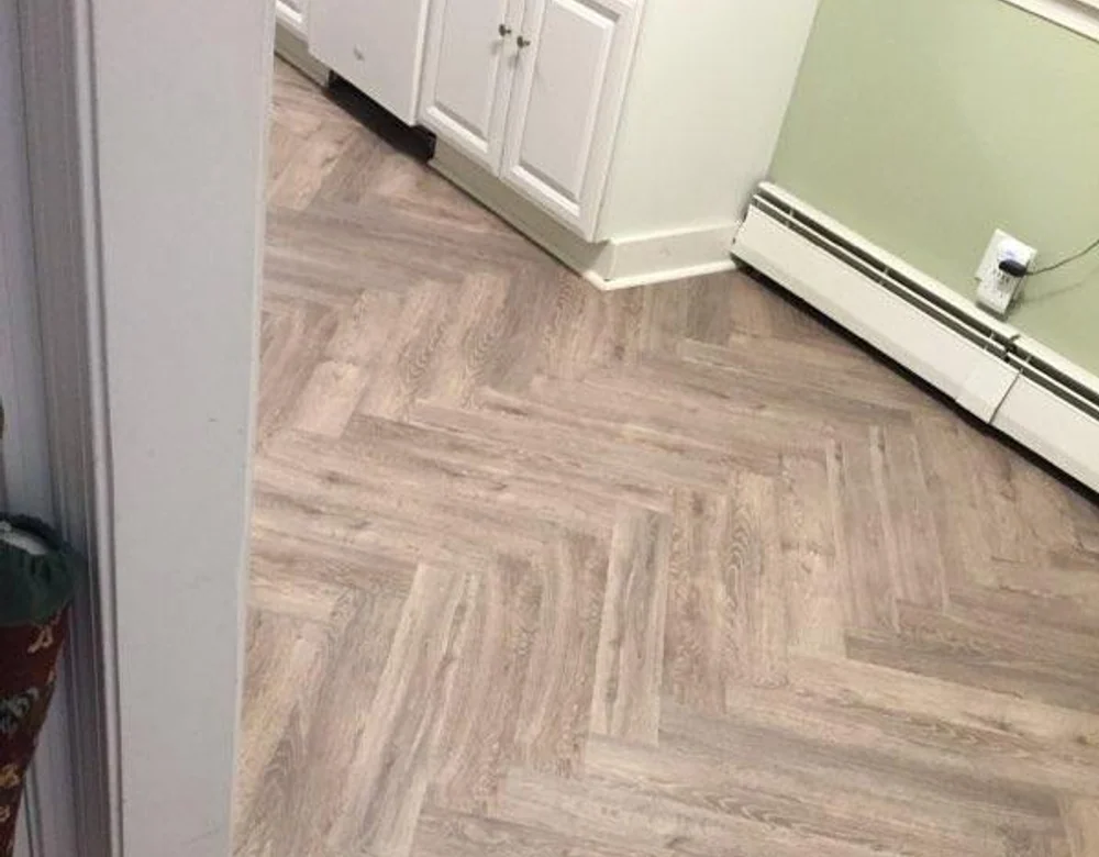 Herringbone LVP kitchen flooring installed in Connecticut