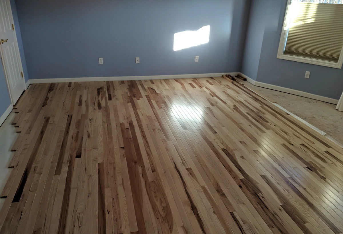 Wide hardwood flooring room installed in Connecticut